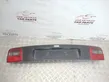 Trunk door license plate light bar