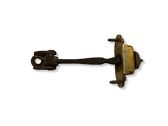 Front door check strap stopper