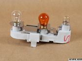 Tail light bulb cover holder