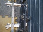 Radiator support slam panel bracket
