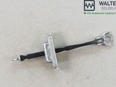 Front door check strap stopper