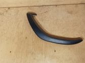 Front door interior handle trim