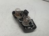 Tail light bulb cover holder