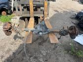 Rear axle beam with reductor