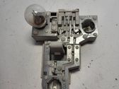 Tail light bulb cover holder