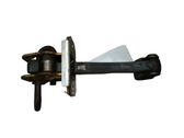 Front door check strap stopper