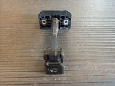 Front door check strap stopper
