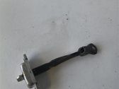 Front door check strap stopper
