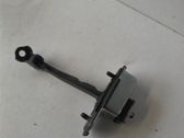 Front door check strap stopper