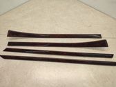 Front door trim bar