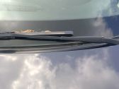 Front wiper blade arm