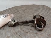 Front door check strap stopper
