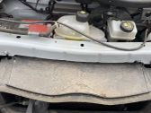 Top upper radiator support slam panel