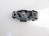 Tail light bulb cover holder