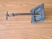 Front door check strap stopper