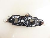 Tail light bulb cover holder