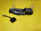Tail light bulb cover holder