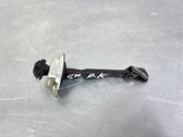 Front door check strap stopper