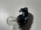 Tail light bulb cover holder