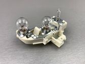 Tail light bulb cover holder