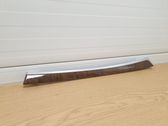 Front door trim bar