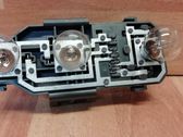 Tail light bulb cover holder