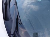 Front wiper blade arm