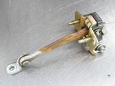 Front door check strap stopper