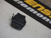 Botón interruptor de bloqueo de puertas
