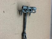 Front door check strap stopper