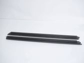 Front door trim bar