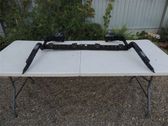Rear bumper mounting bracket