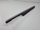 Front door trim bar