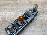Tail light bulb cover holder