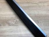 Front door trim bar