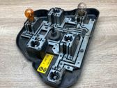 Tail light bulb cover holder