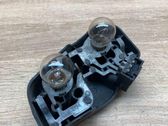 Tail light bulb cover holder