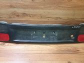 Trunk door license plate light bar