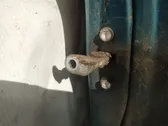 Front door check strap stopper