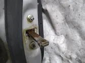 Front door check strap stopper