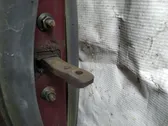 Front door check strap stopper