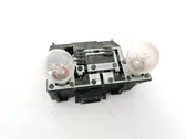 Tail light bulb cover holder