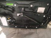 Regulador con motor de la ventanilla de la puerta corredera