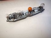 Tail light bulb cover holder