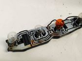 Tail light bulb cover holder
