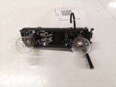 Tail light bulb cover holder