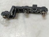 Tail light bulb cover holder