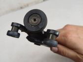 Sliding door lower roller guide/hinge
