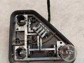 Tail light bulb cover holder