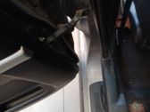 Rear door check strap stopper